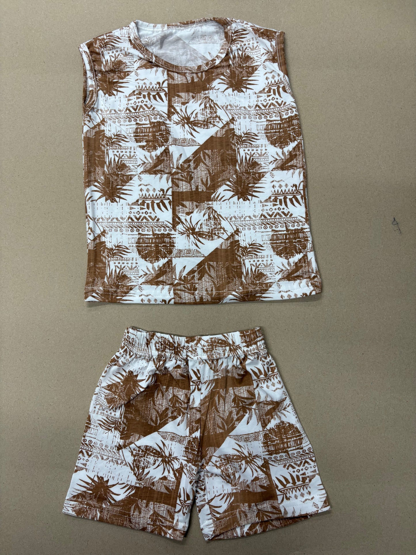 This is a Tav Pacific Rahiti singlet featuring a brown and white tropical print -Sleeveless co-ords