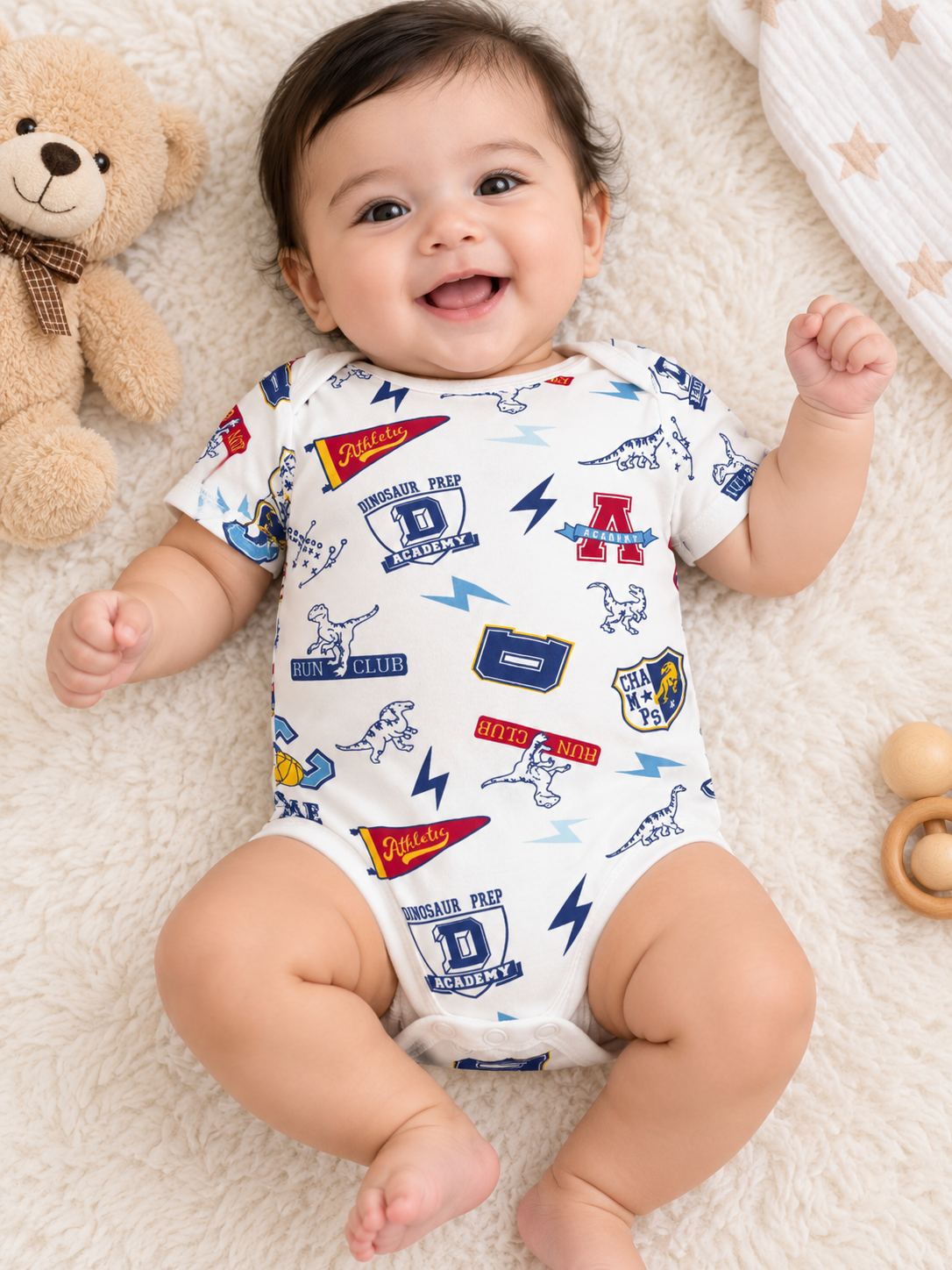 cream/off-white with navy blue, light blue, red, and yellow printed baby Jumsuit